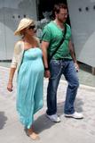 Tori Spelling shows off her baby bump as she and husband film a scene for their reality show